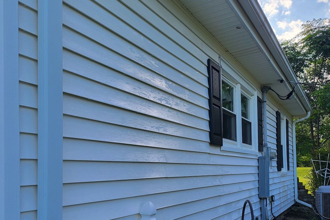 Clean white vinyl siding on a home after a soft wash house washing by Carolinas Premier Softwash